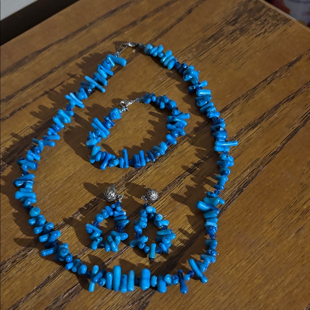 Homemade beaded necklace, bracelet and pierced drop earrings.